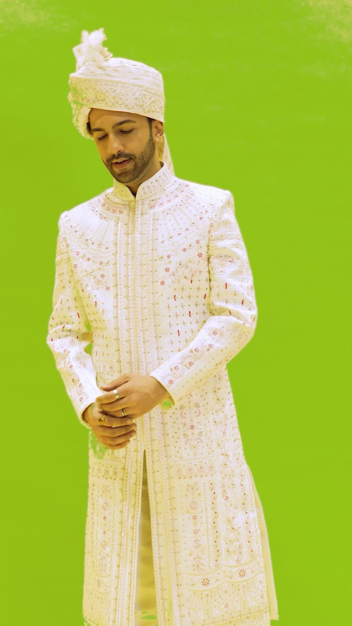 Coveted Cream Sherwani Enriched with Maroon Embroidery